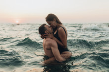 Lovely Couple Kissing In The Sea