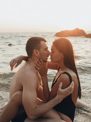 Wall Mural - lovely couple kissing in the sea