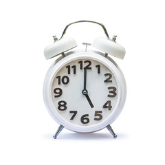 White alarm clock at 5 five o'clock isolated on white background (clipping path)