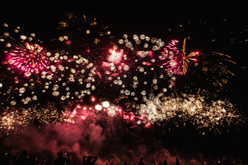 Real Fireworks footage 4k video on Deep Black Background Sky on Futuristic Fireworks festival show before independence day on 4 of July