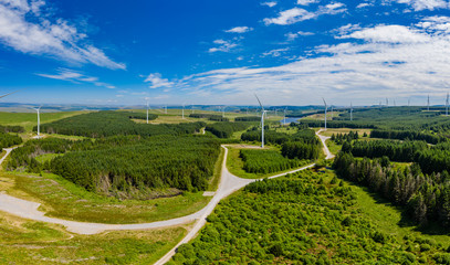 Wall Mural - Aerial drone panorama of turbines at a large onshore windfarm in Wales, UK