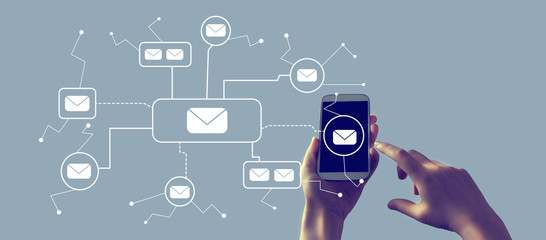 Emails with person holding a white smartphone
