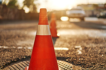 bright orange traffic cones standing in a row