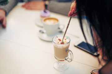 young couple in a cafe drinking coffee. closeup.