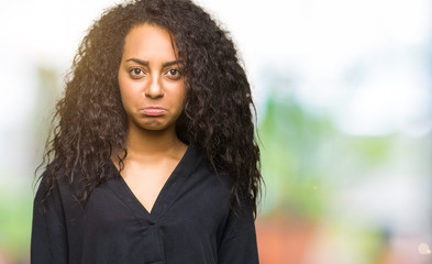 Canvas Print - Young beautiful girl with curly hair wearing elegant dress depressed and worry for distress, crying angry and afraid. Sad expression.