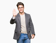 © Krakenimages.com - Young business man wearing glasses over isolated background Waiving saying hello happy and smiling, friendly welcome gesture