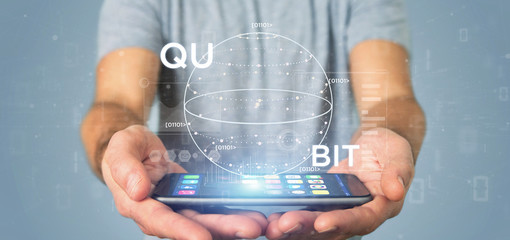 Wall Mural - businessman holding quantum computing concept with qubit icon 3d rendering