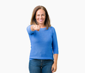 Sticker - Middle age beautiful woman wearing winter sweater over isolated background Punching fist to fight, aggressive and angry attack, threat and violence