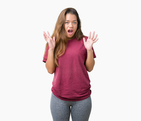 Sticker - Young beautiful brunette woman over isolated background afraid and shocked with surprise expression, fear and excited face.