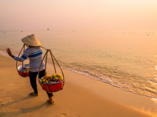 Vietnamese Woman Selling Fruit On The Beach In Phu Quoc
