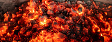 Burning Coals From A Fire Abstract Background.