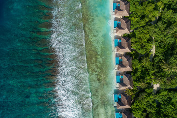 Wall Mural - Aerial view of beautiful island at Maldives in the Indian Ocean. Top view from drone.