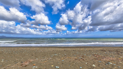 Sticker - View of mediterranean beach with fluffy clouds