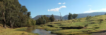 Panoramic Views Of Green Native Australian Farm Land Around A Washed Out River Crossing Near Properties In Rural New South Wales, Australia