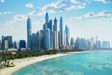 Poster - Dubai, UAE United Arabs Emirates. City of skyscrapers, Dubai marina in the sunny day with front line of beach hotels and blue water of Persian gulf 