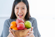 healthy and beautiful asian woman smile happiness with bowl of fresh fruit diet and eat  good nutrition healthy ideas concept