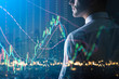 © whyframeshot - executive smart caucasian businessman  trade and invest in stock market doubke exposure with financial stock chart business ideas concept
