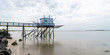 blue and white fishing hut on wood stilts in web banner template in France at Fouras