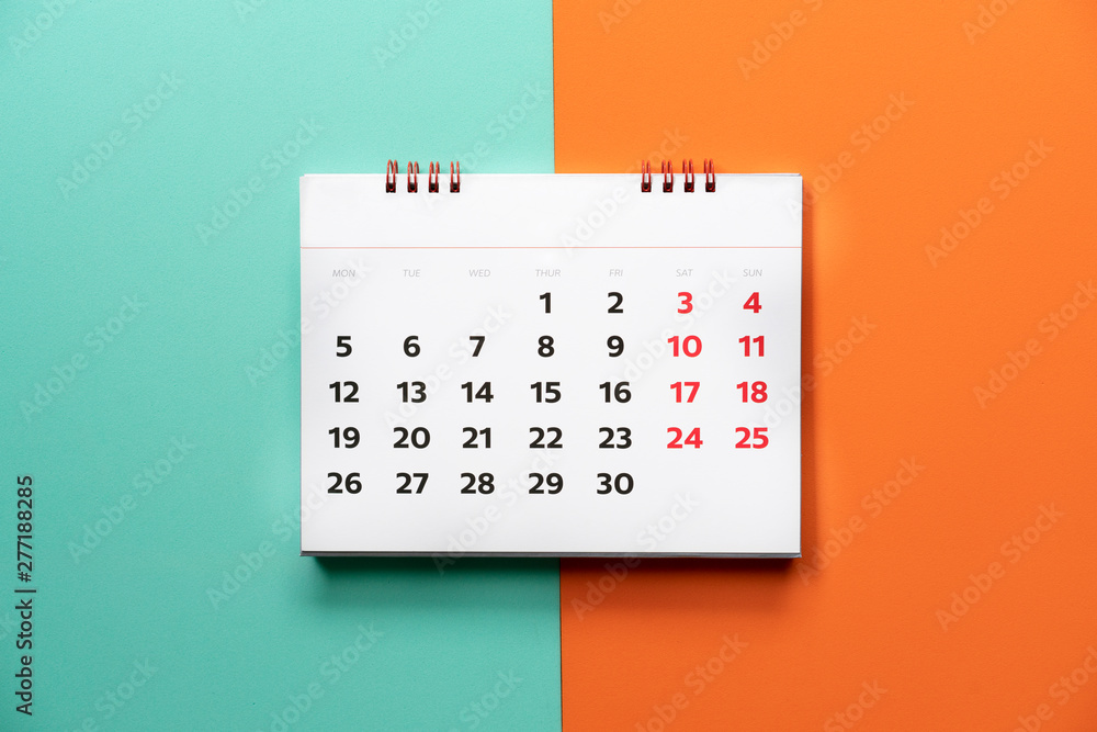 close up of calendar on the color table, planning for business meeting or travel planning concept - obrazy, fototapety, plakaty 