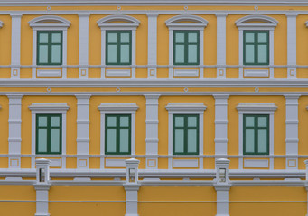 Traditional decorated windows with wooden shutters of old building in Bangkok , Thailand