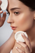 © Yakobchuk Olena - Beautiful female is holding cosmetic cotton discs in studio