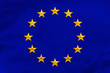 © kittyfly - European Union flag, symbol of united Europe on soft silk with soft folds, close-up