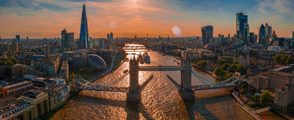 Canvas Print - Orange sunset over Tower Bridge in London, UK. Tower Bridge lifting gates.