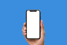 Hand Holding The Black Smartphone With Blank Screen And Modern Frame Less Design On Blue Colour Background