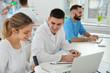 © New Africa - Medical students working in modern scientific laboratory
