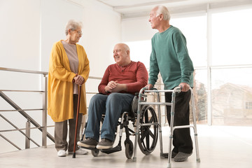 Wall Mural - Group of happy senior people in hospital