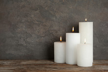 Alight Wax Candles On Table. Space For Text