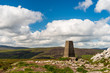 Marker on the Two Rock summit also known as Fairy Castle in Dublin Mountains, Ireland. Mountain landscape from Ticknock recreation site on a summer day.