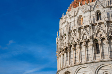 Wall Mural - Pisa Baptistry gothic facade and blue sky (with copy space)