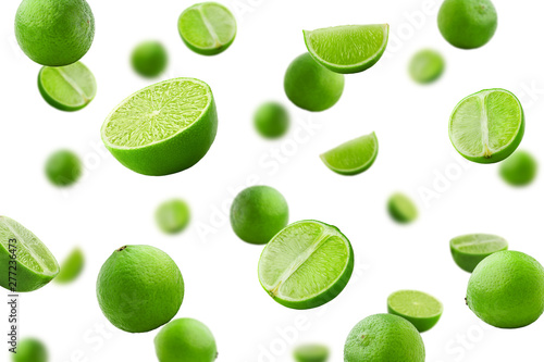 Cuadros en Lienzo Falling lime isolated on white background, selective focus