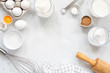 © Vladislav Noseek - Frame of baking and cooking bread pastry or cake ingredients, flour sugar milk eggs and coconut butter on bright grey background with copy space for text, flat lay