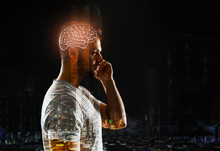 Double Exposure Of Man With Glowing Brain And City