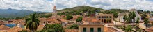 Aerial Panoramic View Of A Small Touristic Cuban Town During A Sunny And Cloudy Summer Day. Taken In Trinidad, Cuba.