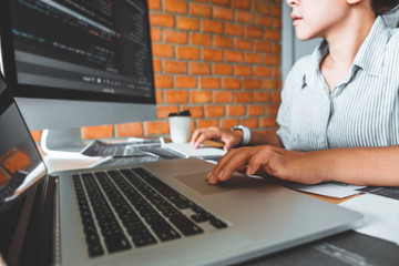 developing concentrated programmer reading computer codes development website design and coding tech