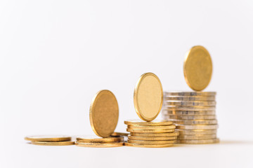 Coins stacked on white background concept about business, finance, banking and investment.