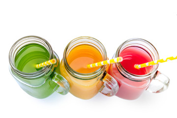 Fresh purple green yellow orange red e in jar