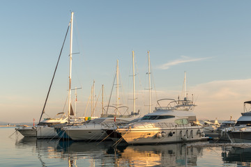 Sunset in Baska Voda town with Adriatic Sea and boats, Croatia