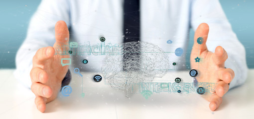 Wall Mural - businessman holding a 3d rendering artificial intelligence concept with a brain and app