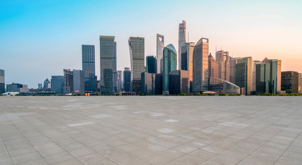 Urban skyscrapers with empty square floor tiles