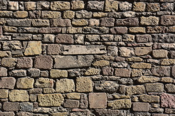 wall made of irregular reddish stones