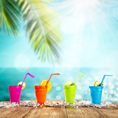 Wall Mural - Summer drink on desk and beach landscape 