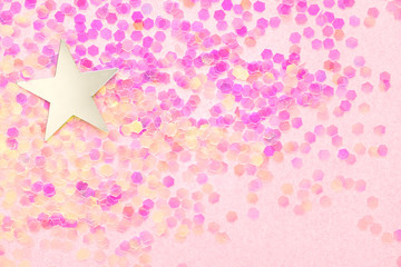 Wall Mural - Confetti and silver stars on a pink background, festive concept.