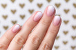 © Darya Lavinskaya - Hand with manicure at the creative background with hearts.