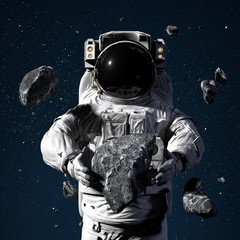 Wall Mural - astronaut with asteroids, part of the solar system