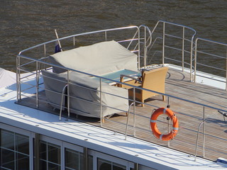 Wall Mural - Storage of ships on the water at the berth - marine furniture in covers on the upper deck of a large motor yacht