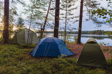 adventures camping tourism and tent under the view forest landscape near water outdoor in summer eve